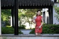 Chinese cheongsam model in Chinese classical garden